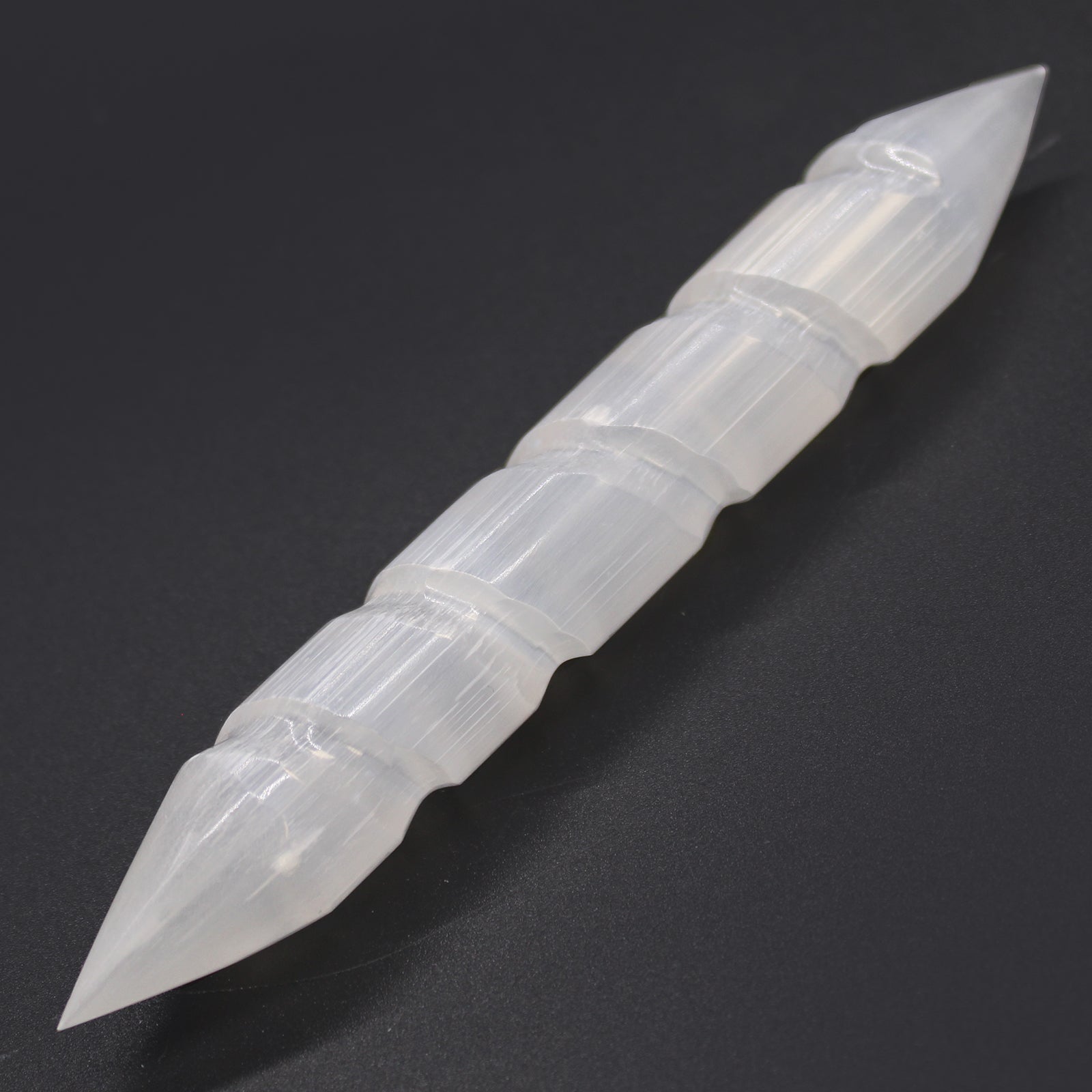 16cm selenite spiral wand featuring double pointed ends and a carved twisted crystal design.