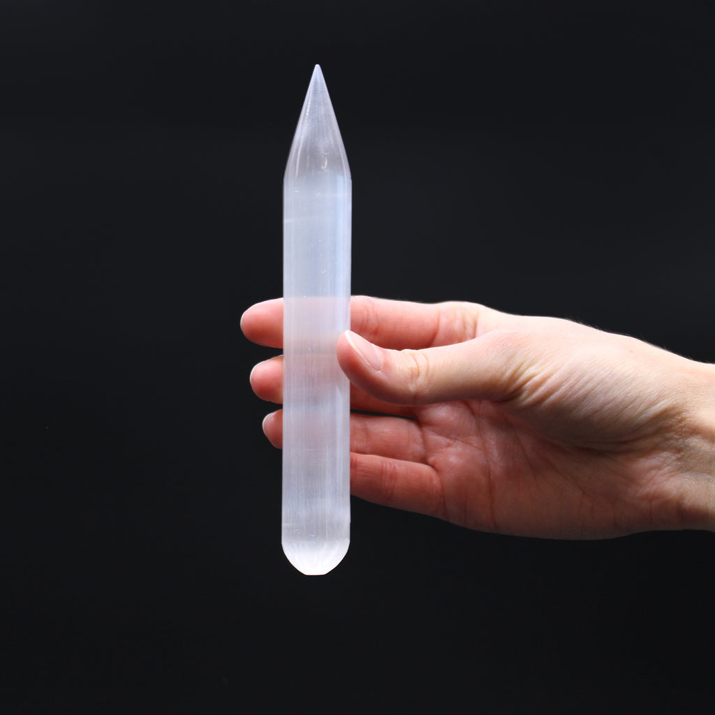 16cm round selenite crystal wand with a polished finish and single pointed tip, crafted from natural white translucent selenite.