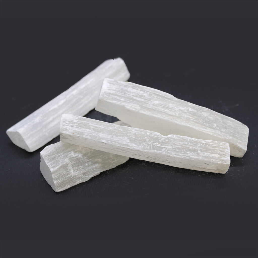 10cm raw selenite crystal stick with natural unpolished texture and white translucent appearance, sold as a single piece.