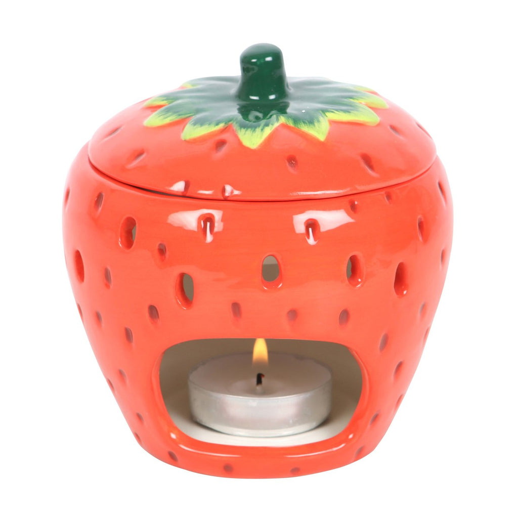 Strawberry shaped ceramic oil burner and wax warmer with bright fruit-inspired decorative design.