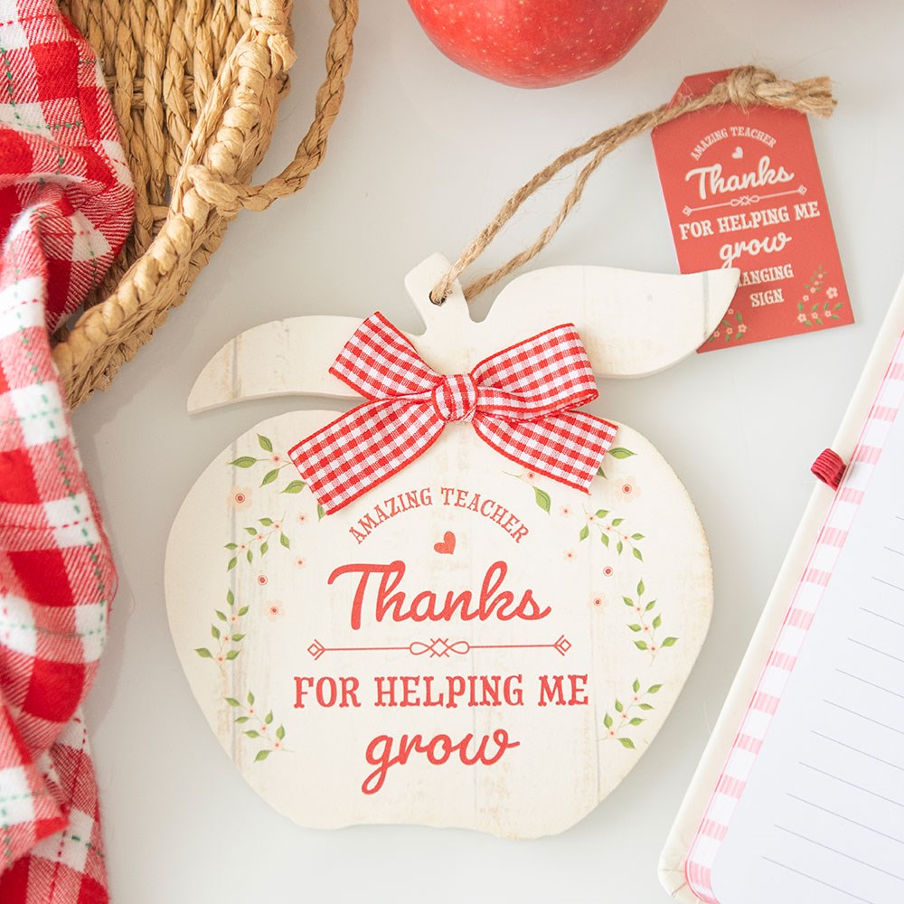 Apple shaped wooden sign featuring “Thanks For Helping Me Grow” message with teacher appreciation design.