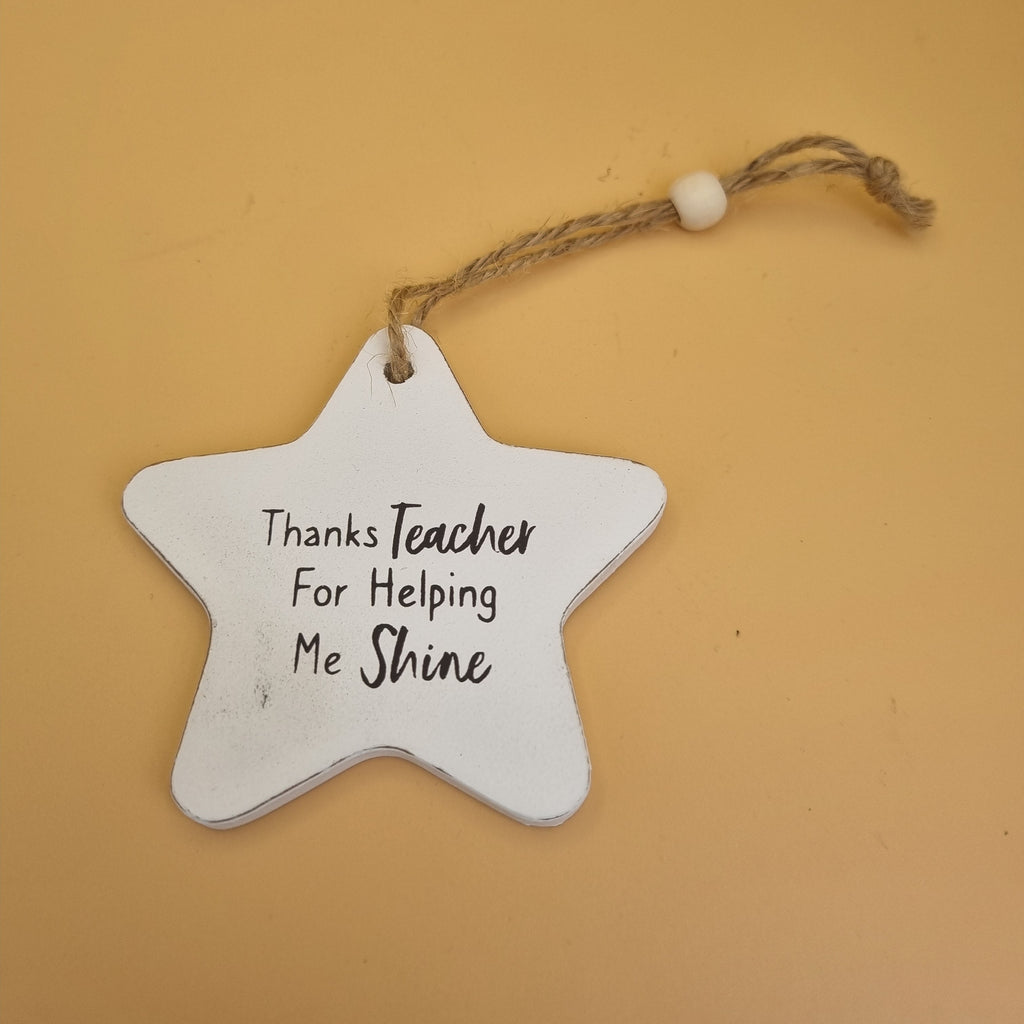 Wooden plaque featuring “Thanks Teacher For Helping Me Shine” message with decorative heartfelt design.
