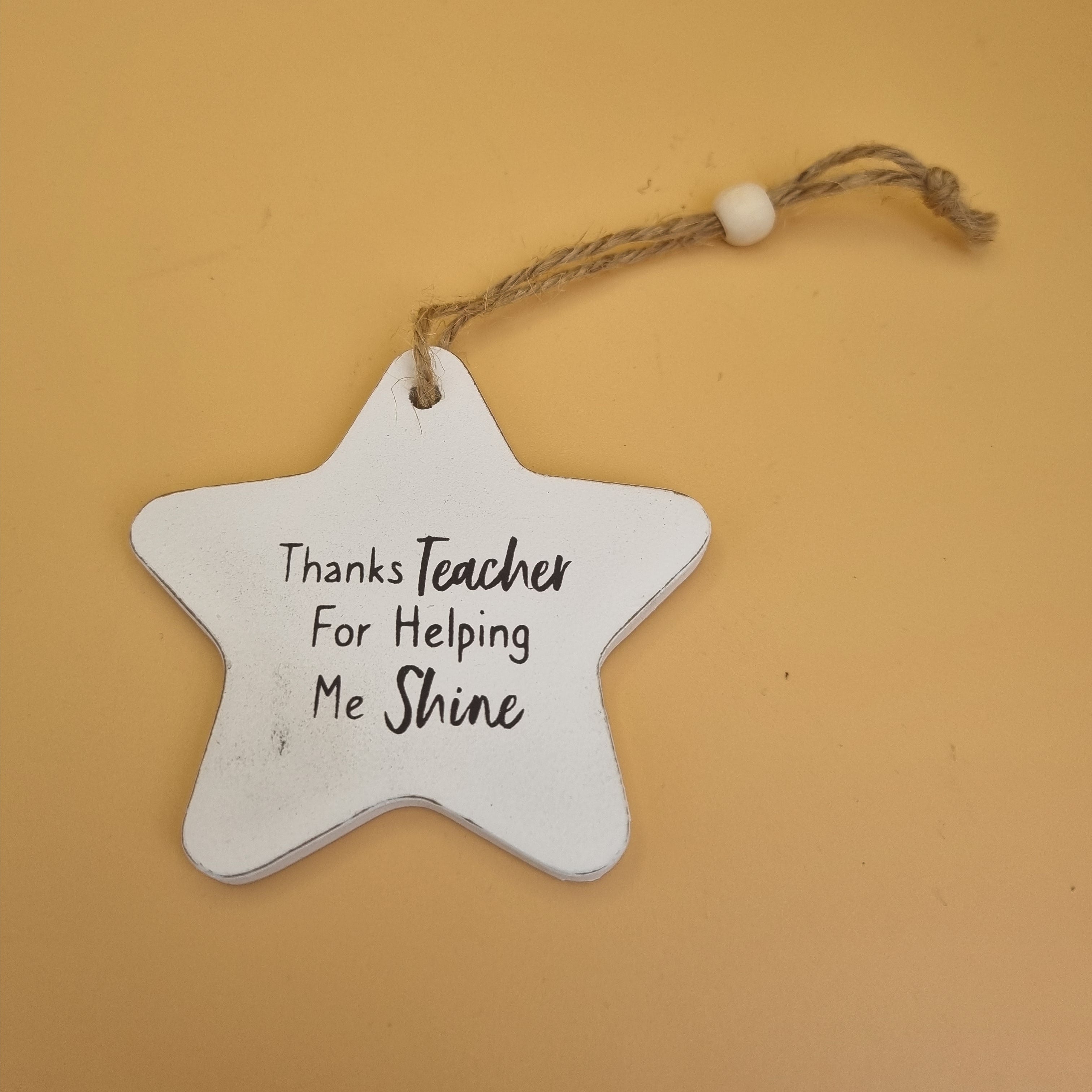 Wooden plaque featuring “Thanks Teacher For Helping Me Shine” message with decorative heartfelt design.
