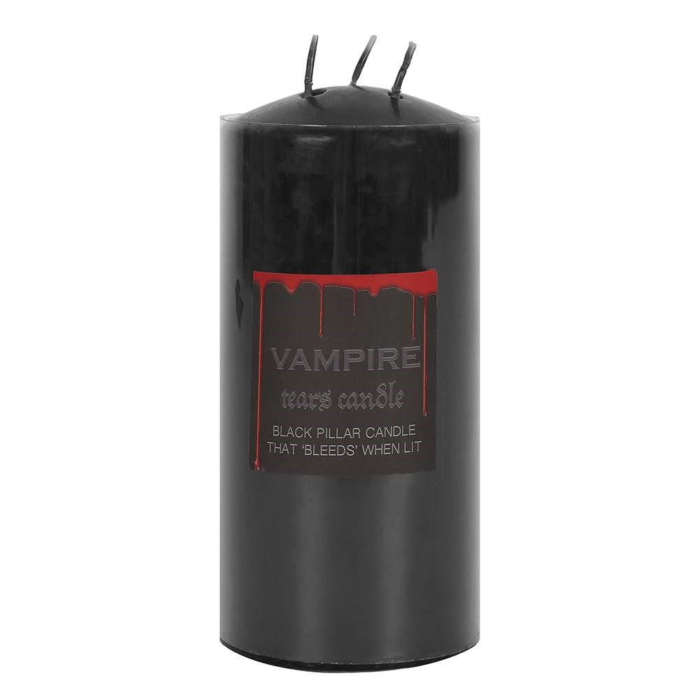 Black triple-wick pillar candle with Vampire Tears label and blood drip design, unlit on a white background