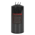 Black triple-wick pillar candle with Vampire Tears label and blood drip design, unlit on a white background