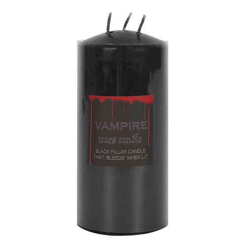 Black triple-wick pillar candle with Vampire Tears label and blood drip design, unlit on a white background