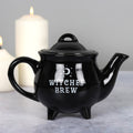 Black ceramic teapot featuring “Witches Brew” text with gothic witch-inspired decorative design.